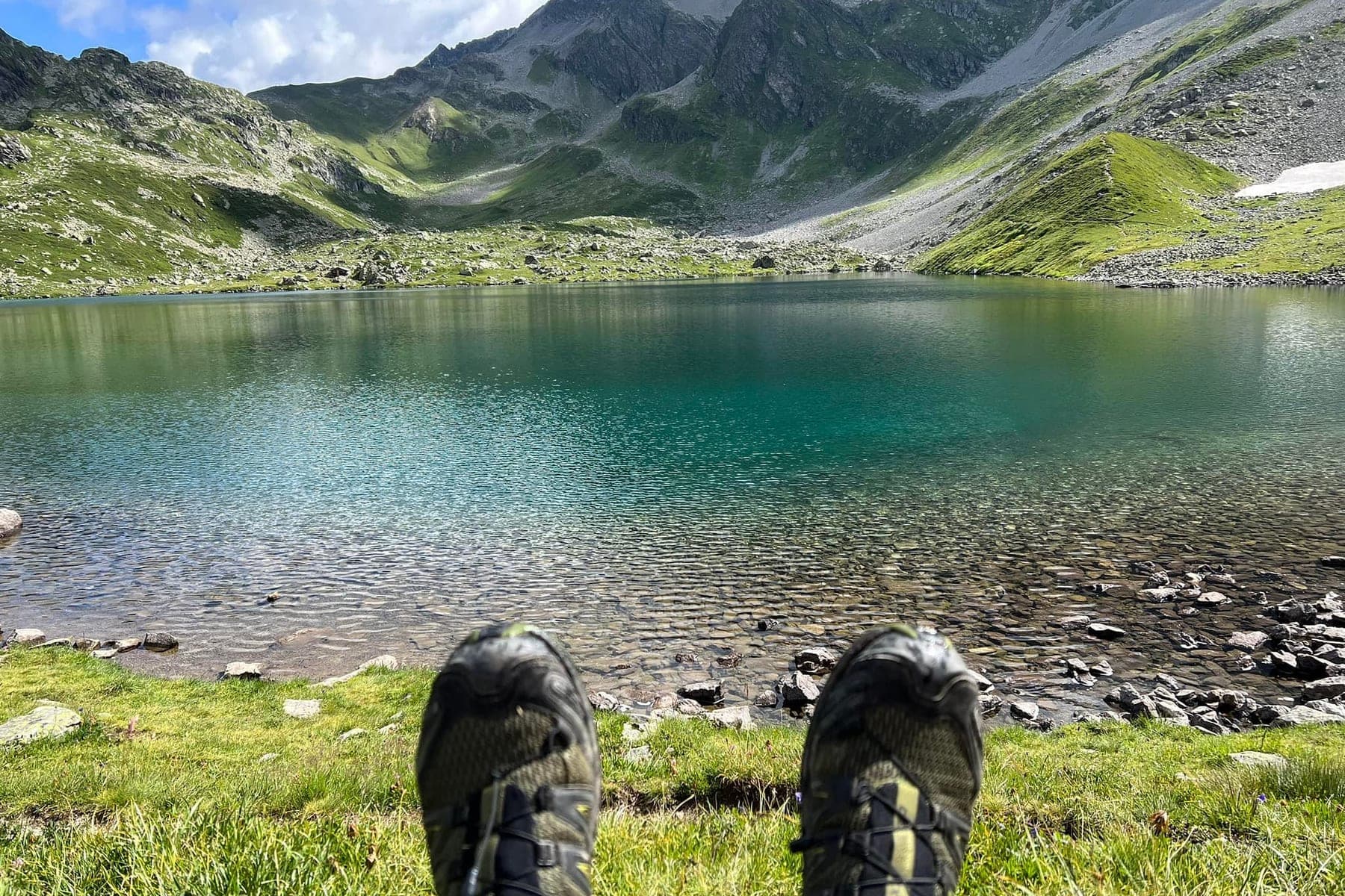 Resting by an alpine lake on the Tour du Mont Blanc